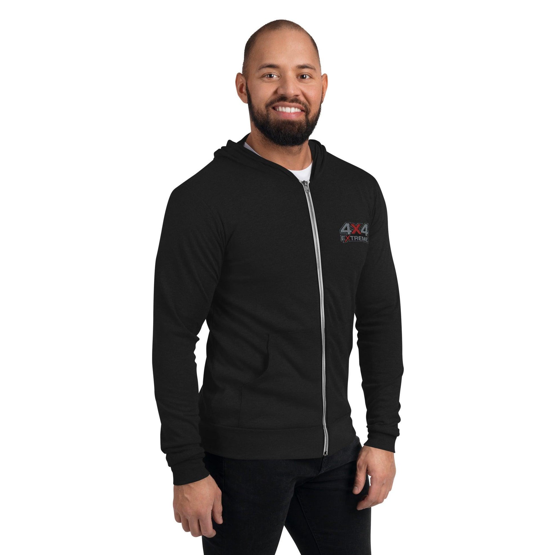 Man wearing black triblend zip hoodie with 4x4 Extreme embroidery in silver and red