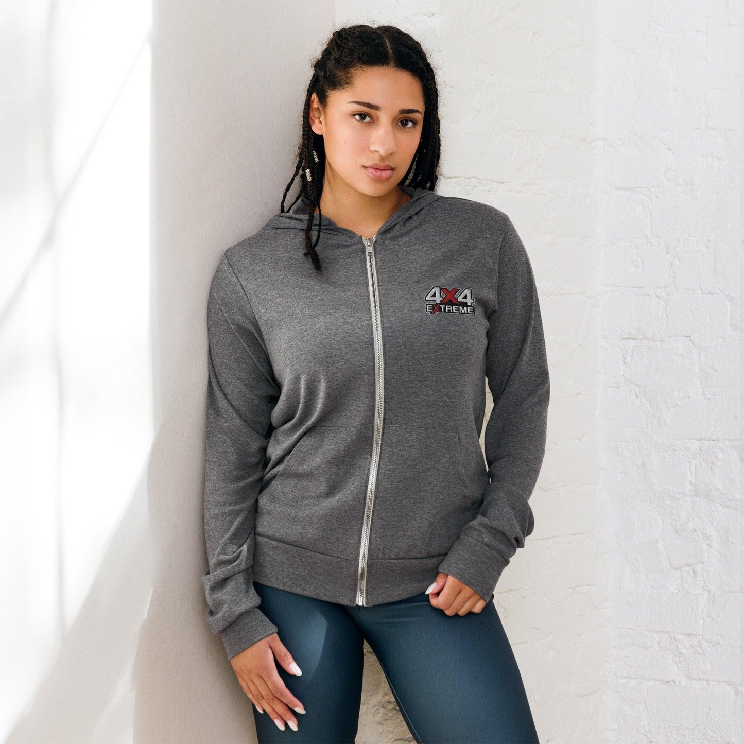 Woman wearing a grey triblend zip hoodie